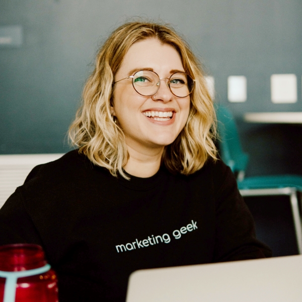 Web Designer Adrienne smiles in candid Tech Park portrait